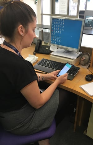 Priory Medical Group staff using mobile to check status