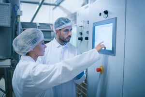 Food technicians working together on food safety risk assessment