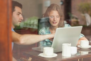 Viewing laptop data insight in cafe